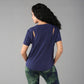 Woman with long black hair wears the Functional - Blue Soft T Shirt, made from a durable poly blend for comfort and style—perfect for versatile outdoor outfits.