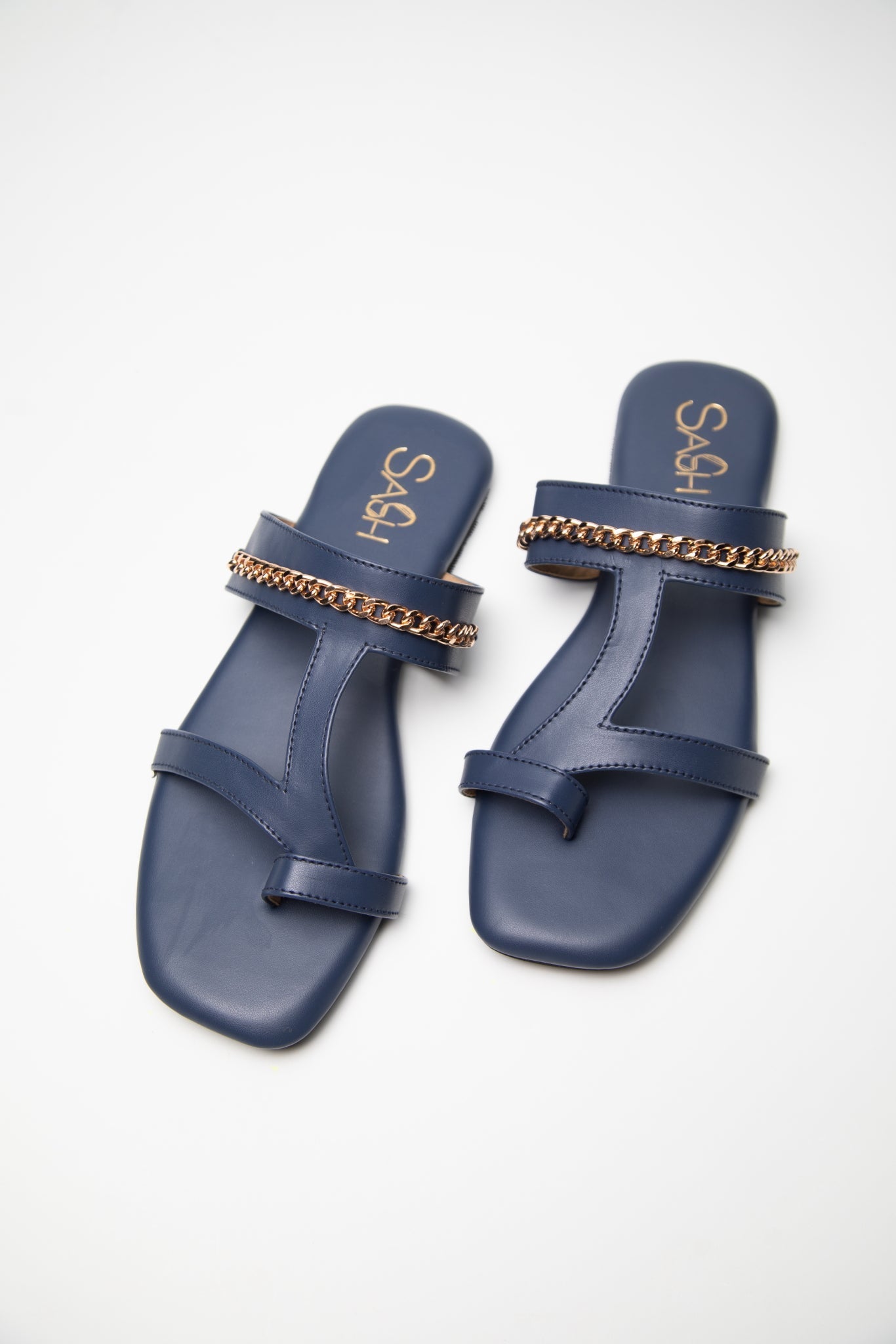 Stylera navy blue flats for women with gold chain detail and toe loop design