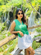 Female model wearing a white mini skirt  from Stylera