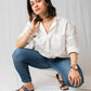Woman wearing navy blue flats for women by Stylera paired with jeans and a white shirt