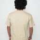 Stylera plain beige tee back view on male model showcasing trendy neutral color t-shirt