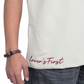 Stylera trendy neutral color t-shirt light beige with red Lovers First hem script shown on model side