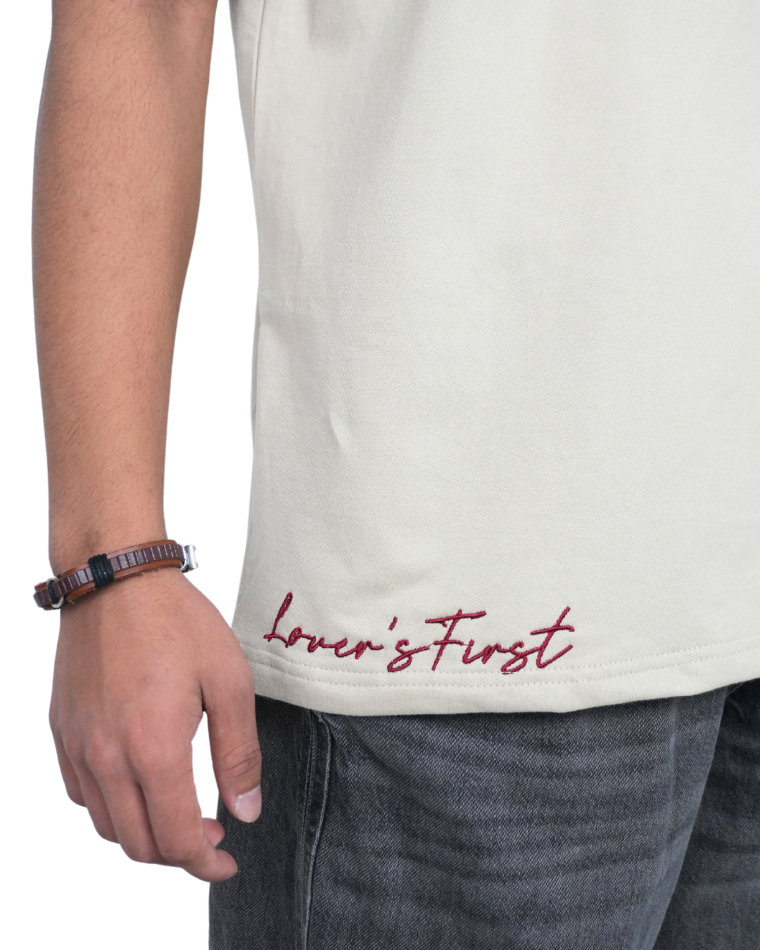 Stylera trendy neutral color t-shirt light beige with red Lovers First hem script shown on model side