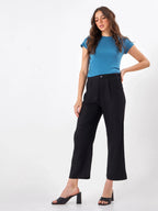 Female model wearing black pants from Stylera