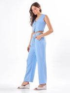 Female model wearing a light blue co-ord set with slip pockets from Stylera