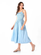Female model wearing a spaghetti light blue dress from Stylera