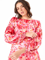 Female model wearing a pink floral mini dress from Stylera