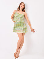 Female model wearing a green striped dress from Stylera