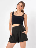 Female model wearing a black shorts from Stylera