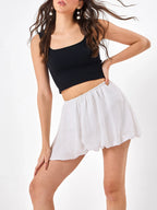 Female model wearing a white puff mini skirt  from Stylera
