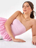 Female model wearing a strapless checkered pink top from Stylera