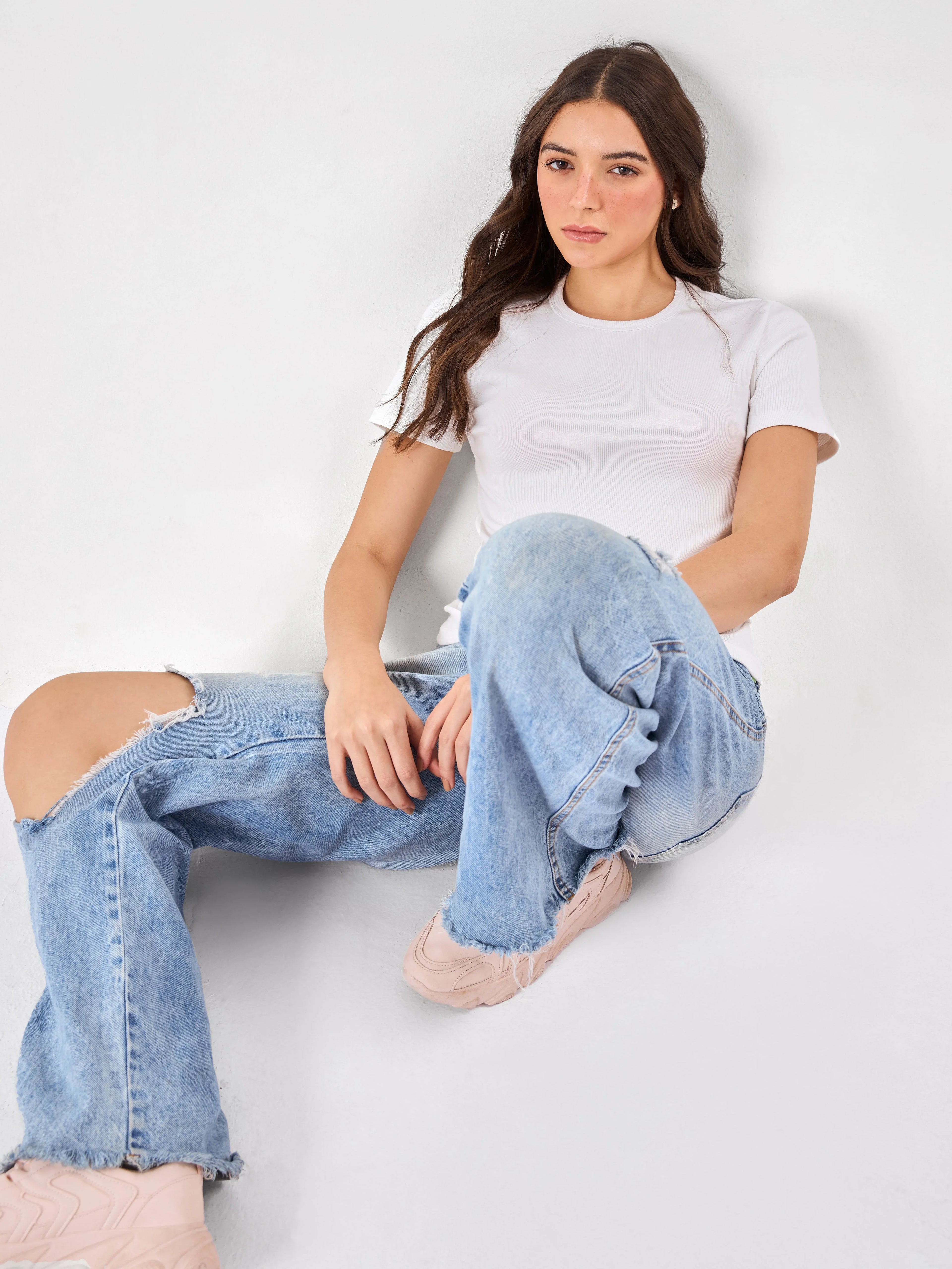 Female Model wearing breathable white top from Stylera