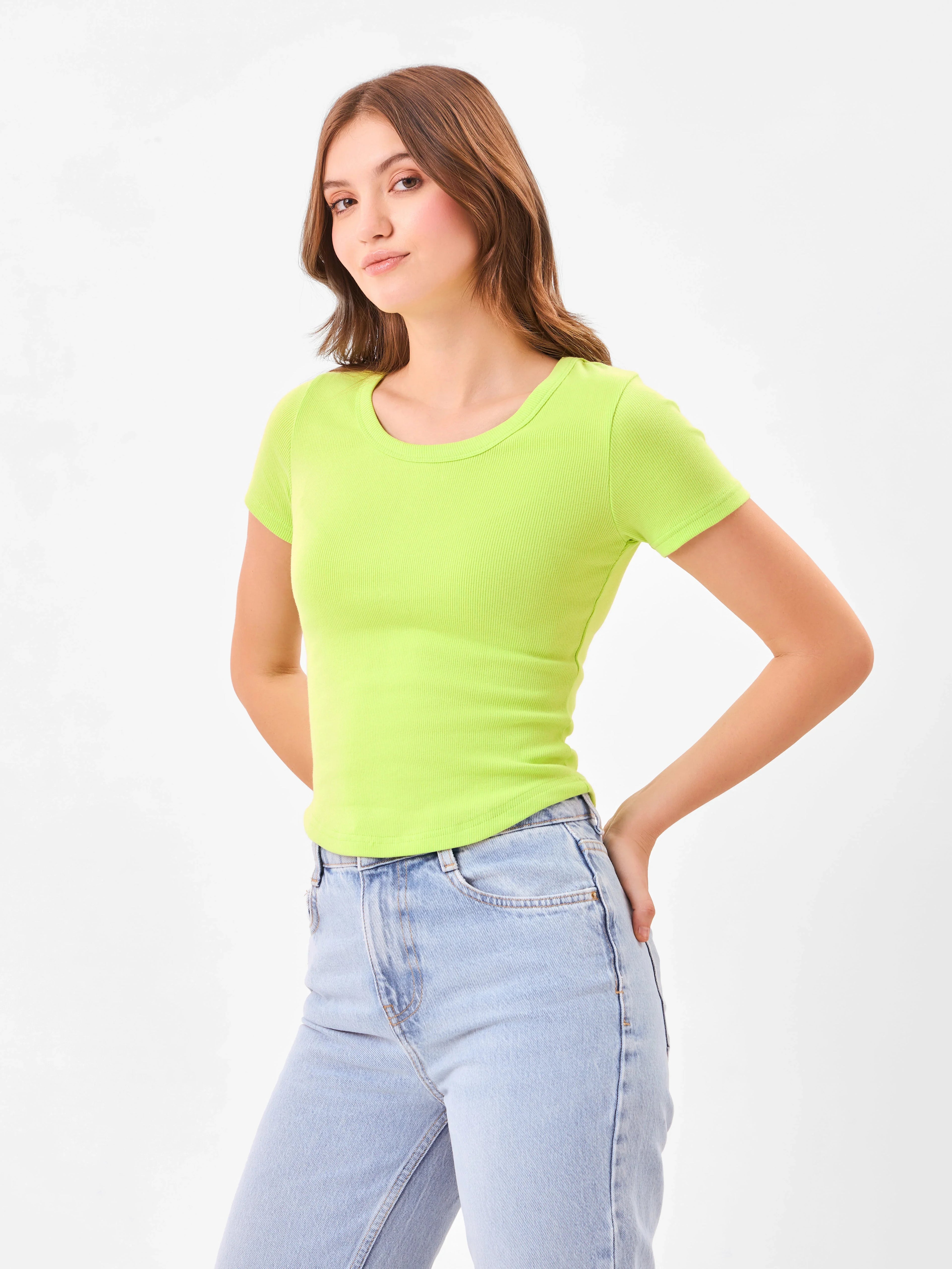 Female model wearing a bright green t-shirt from Stylera
