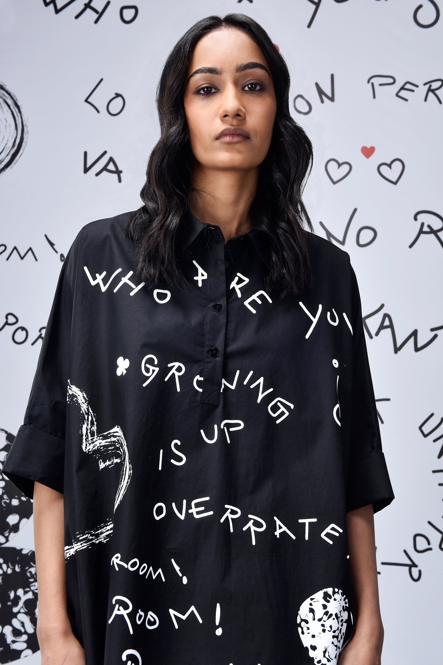 Model wearing Stylera black scribble print shirt oversized button front with white doodle graphics