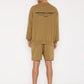 Back view of man wearing Stylera brown graphic sweatshirt for men with black back logo and relaxed fit