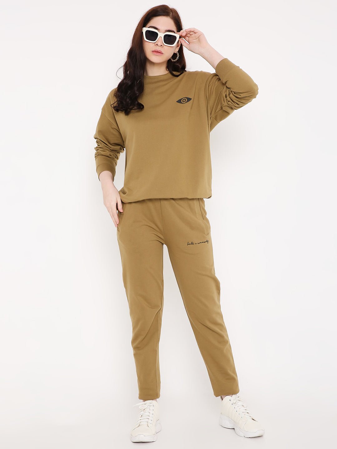 Stylera brown graphic sweatshirt for men paired with matching joggers white sneakers and sunglasses