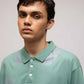 Stylera mint green polo T shirt on male model with three buttons and subtle shoulder print casual men's fashion polo