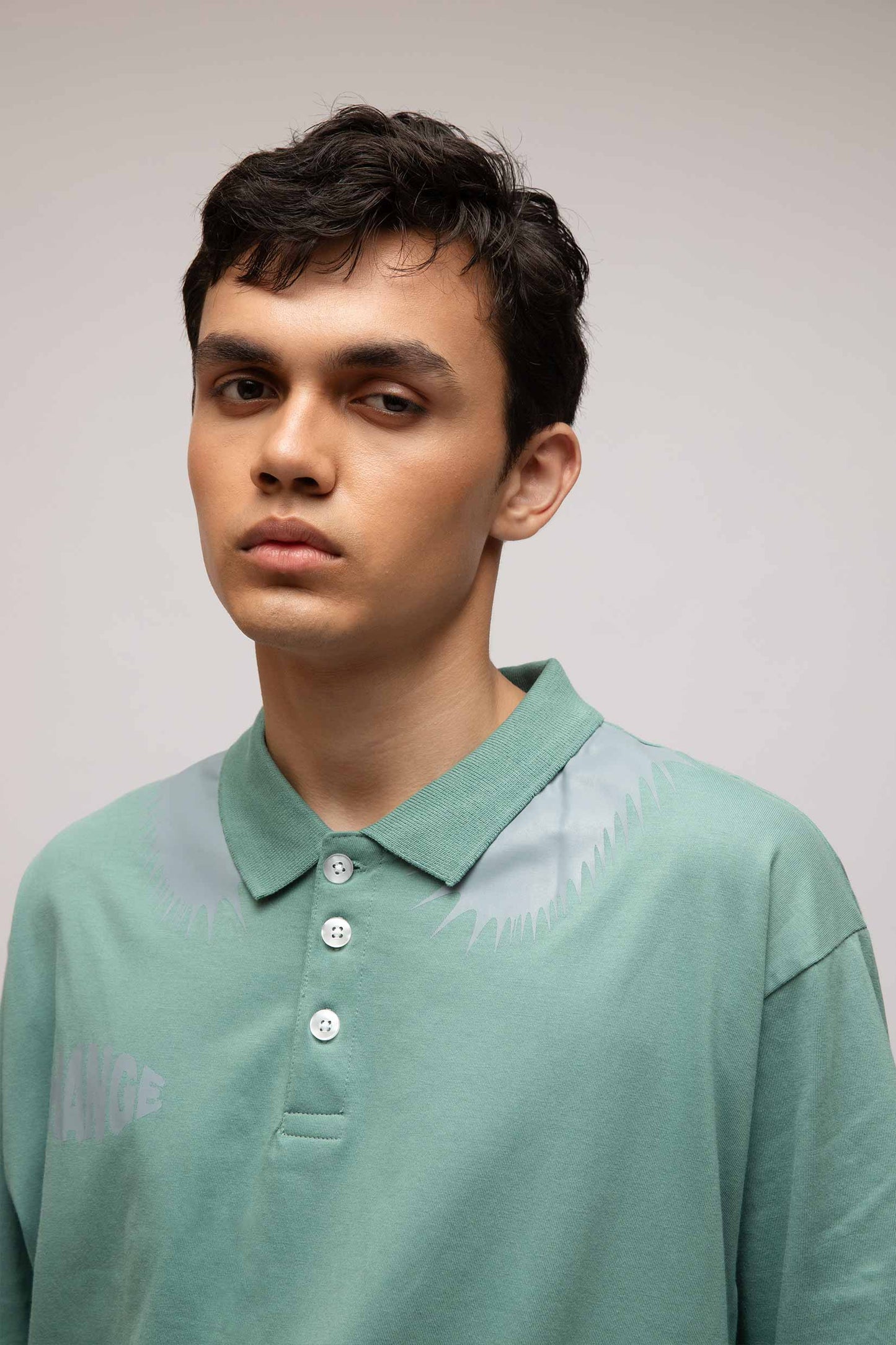 Stylera mint green polo T shirt on male model with three buttons and subtle shoulder print casual men's fashion polo