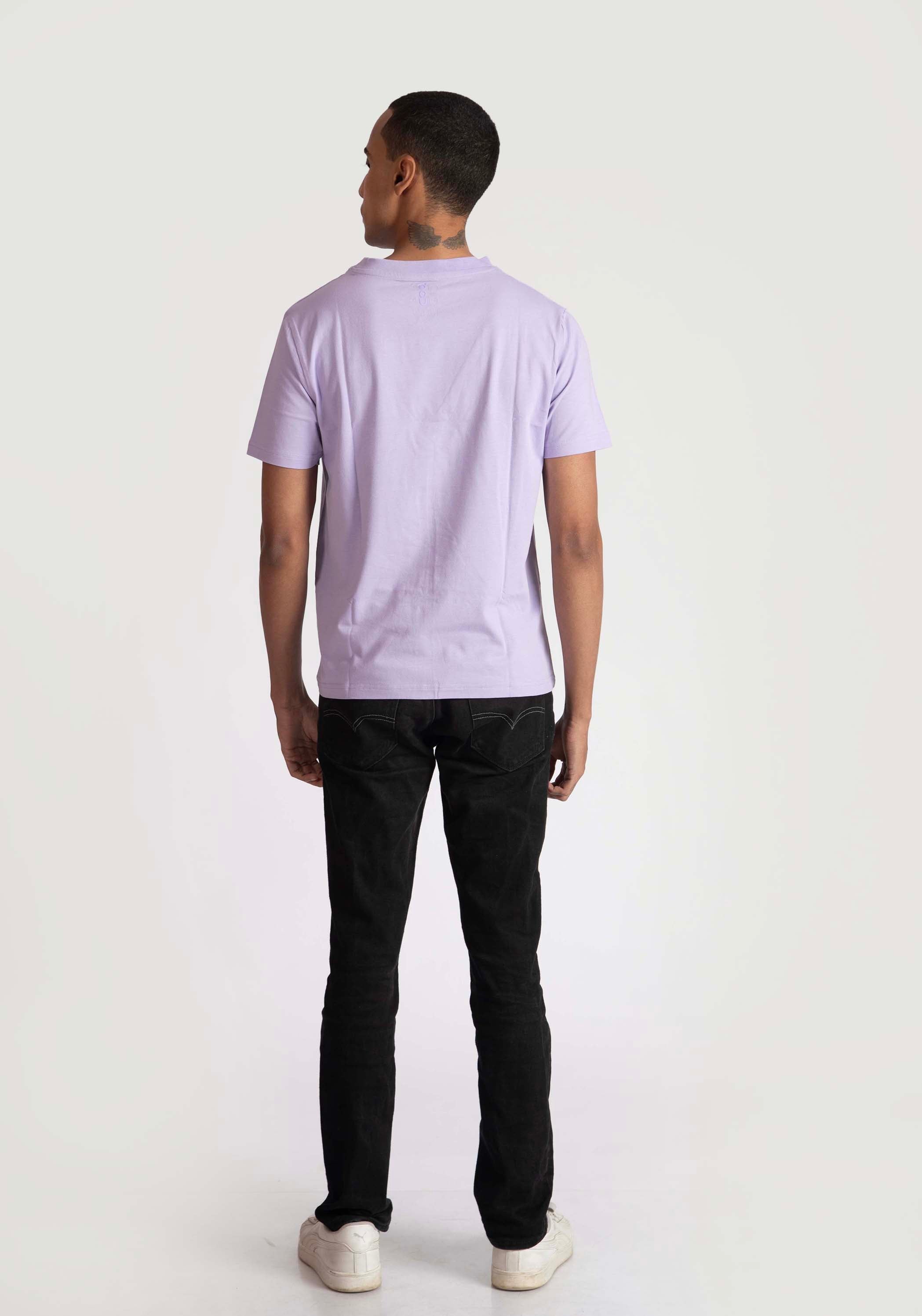 Back view of a man wearing a lavender t-shirt for men paired with black pants and white shoes
