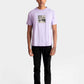 Stylera lavender t-shirt for men with graphic print paired with black pants and white sneakers
