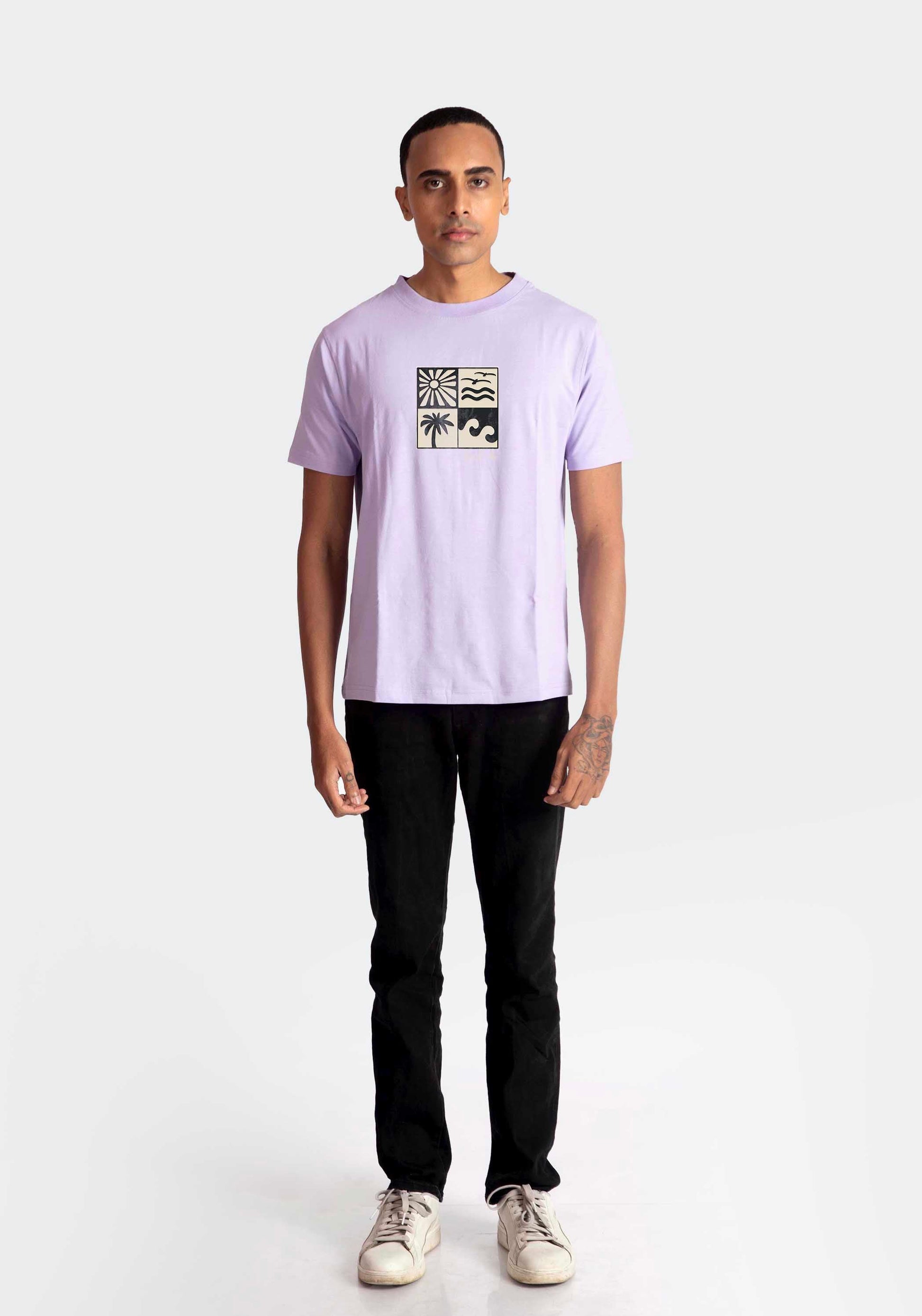 Stylera lavender t-shirt for men with graphic print paired with black pants and white sneakers