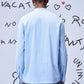 Back view of man wearing light blue regular fit shirt by Stylera paired with gray pants