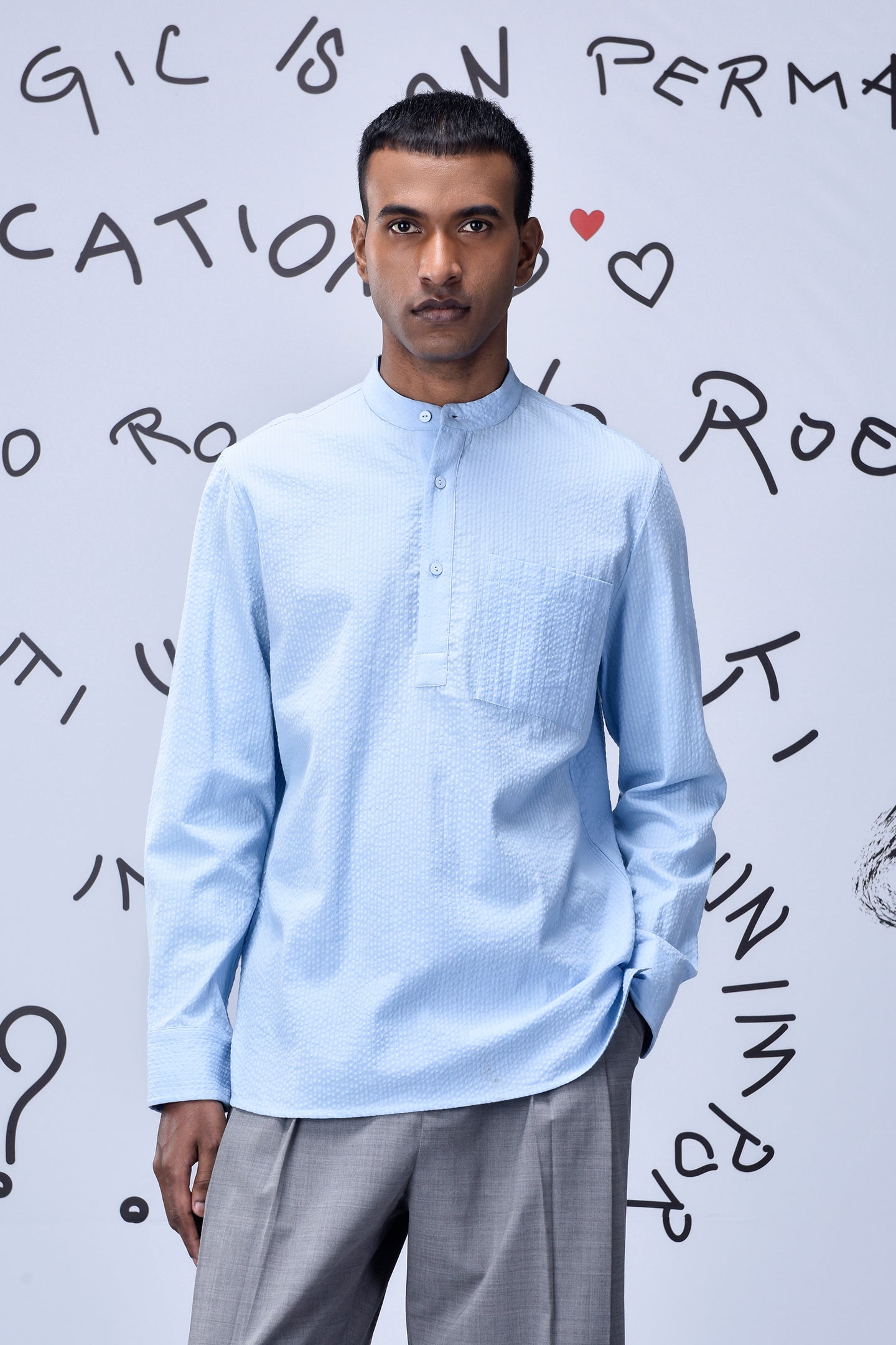 Man wearing a light blue regular fit shirt by Stylera with a mandarin collar and long sleeves