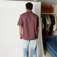 Stylera men's maroon striped shirt shown from back on model short sleeve casual fit with light wash jeans