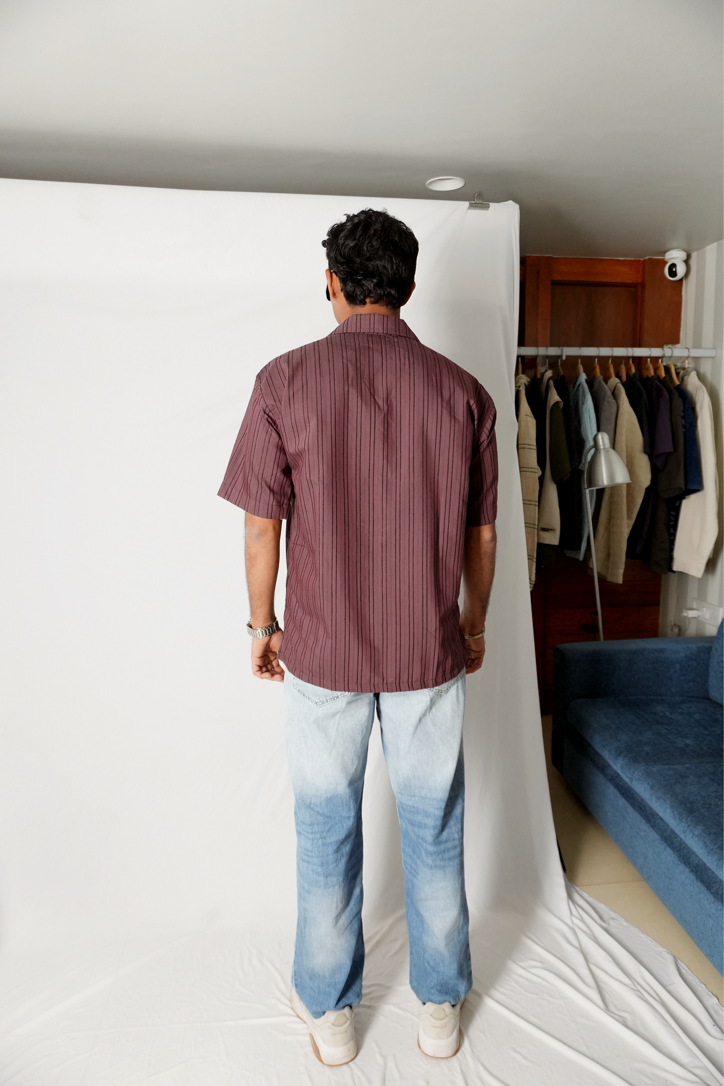 Stylera men's maroon striped shirt shown from back on model short sleeve casual fit with light wash jeans