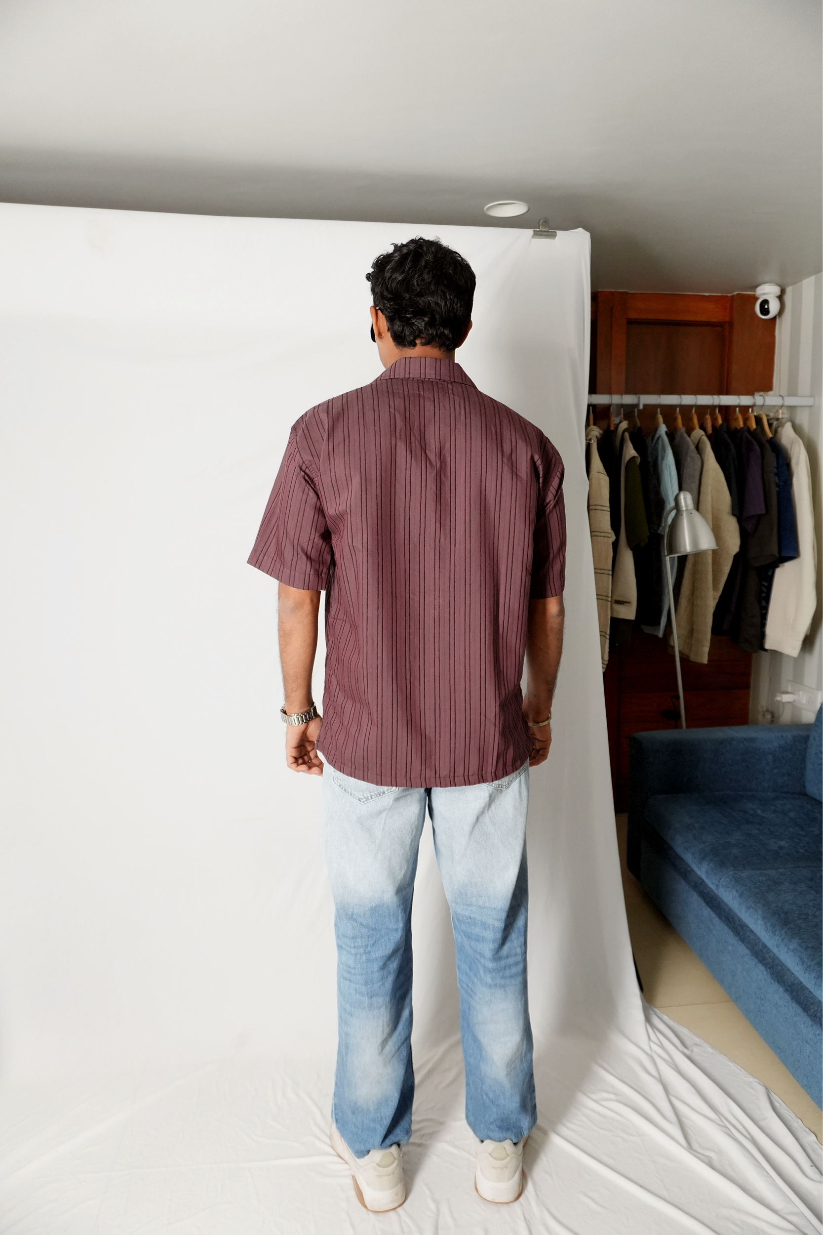 Stylera men's maroon striped shirt shown from back on model short sleeve casual fit with light wash jeans