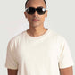 Man wearing Stylera men's trendy cream t-shirt with short sleeves and round neck