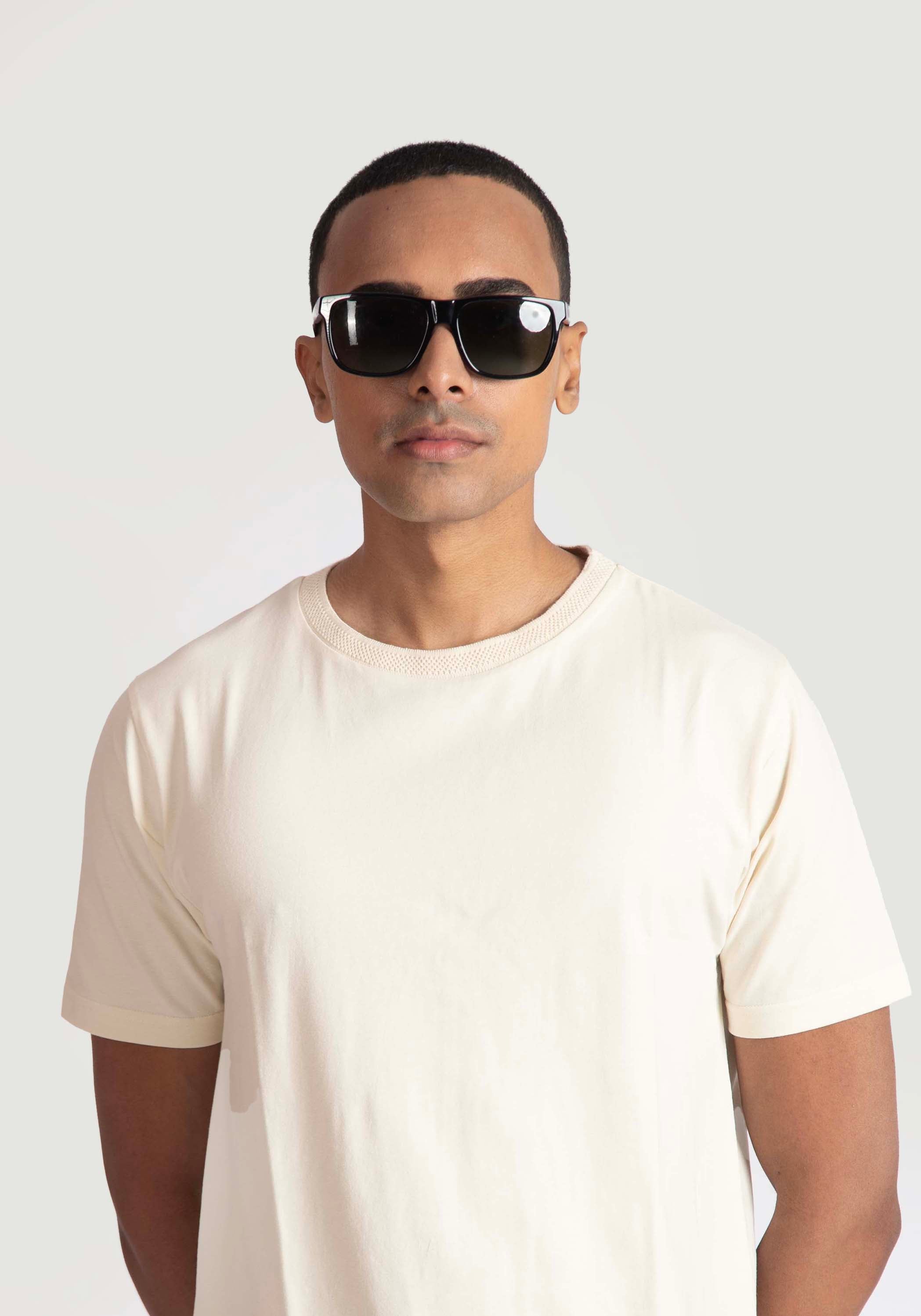 Man wearing Stylera men's trendy cream t-shirt with short sleeves and round neck