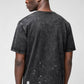 Stylera men's trendy graphic tee washed black back view with paint splatter distress on model