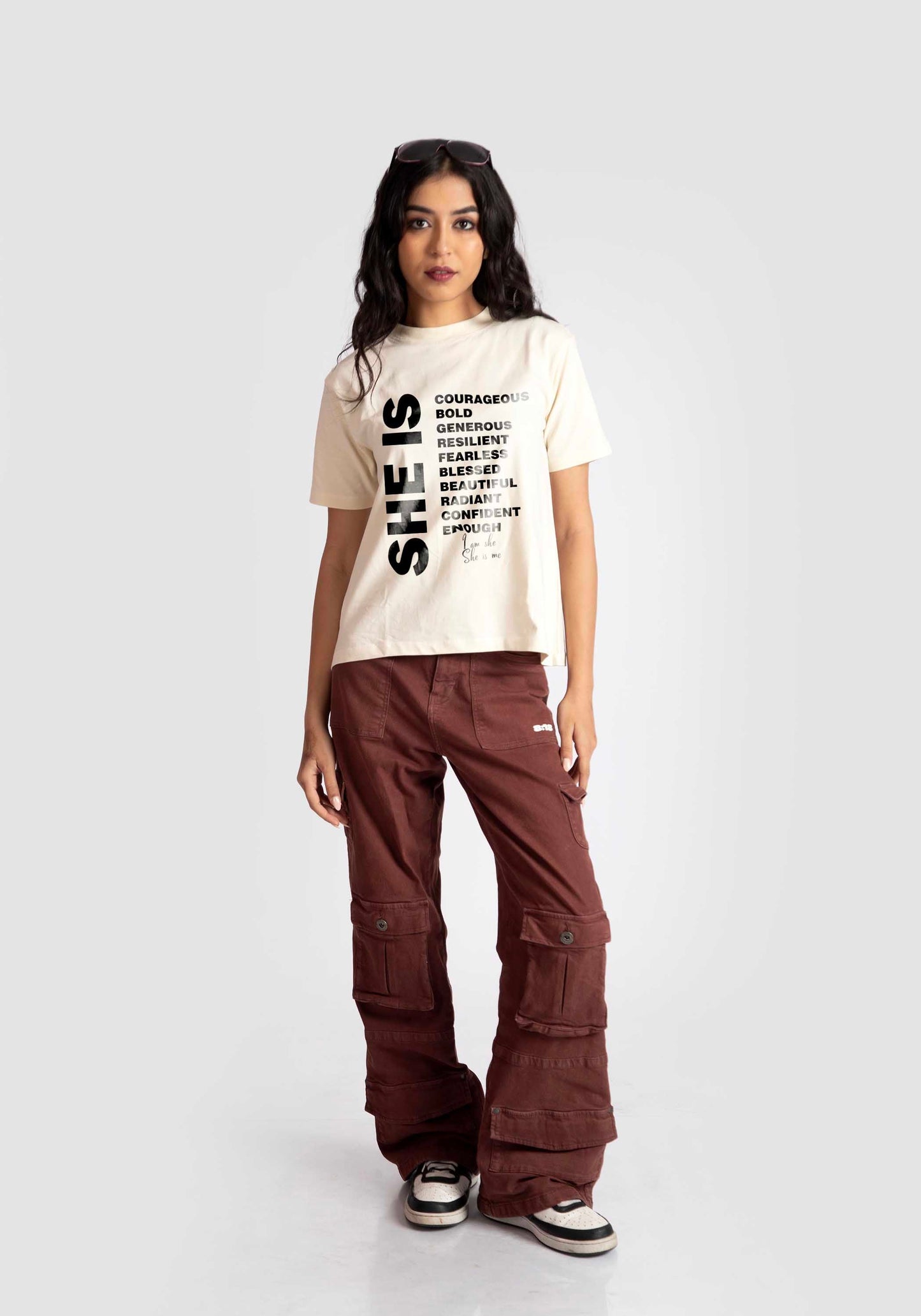 Stylera motivational quote off white t-shirt for women styled with brown cargo pants and sneakers