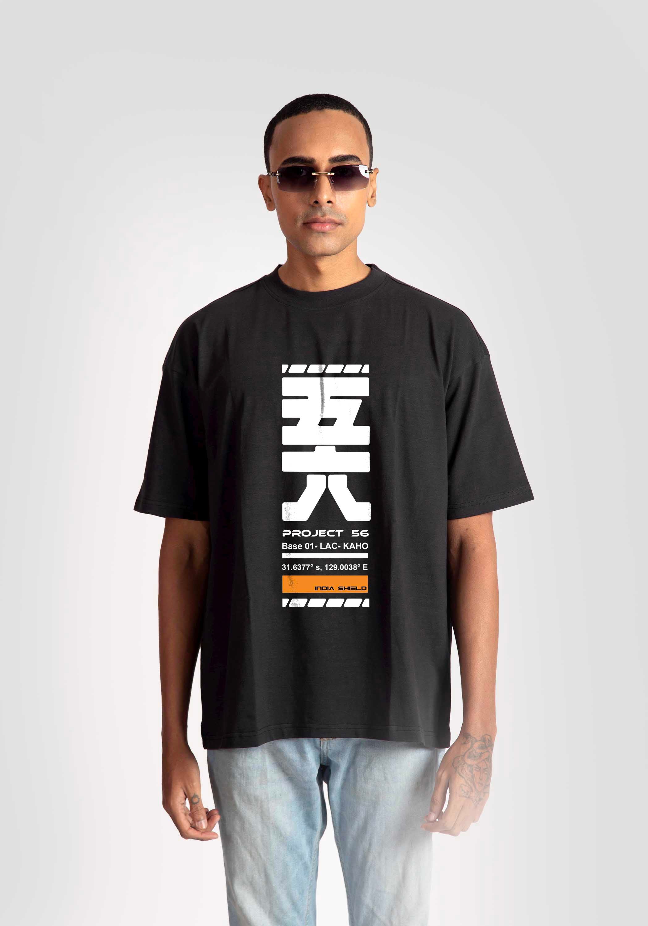Stylera black oversized fashion t-shirt for men with white graphic print worn with light jeans