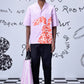 Stylera pink relaxed fit shirt for men styled with black pants and striped tote bag