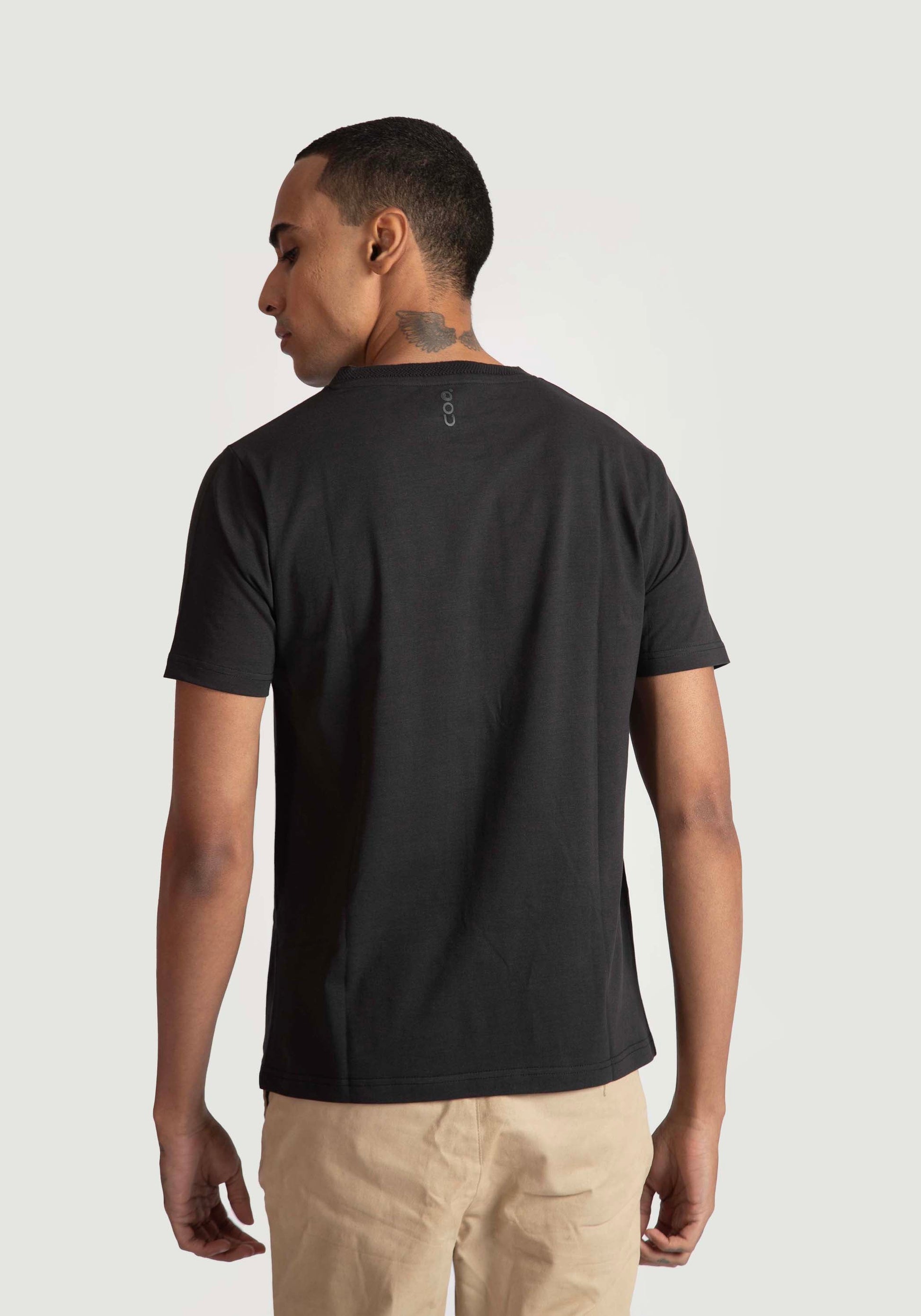 Stylera regular fit black tee for men shown from the back on a male model
