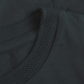 Close-up of Stylera regular fit black tee for men showing textured neckline and smooth fabric