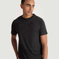Stylera regular fit black tee for men worn by a male model with short hair and beige pants
