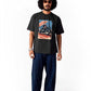 Man wearing Stylera regular fit graphic motorcycle tee with blue pants and sunglasses