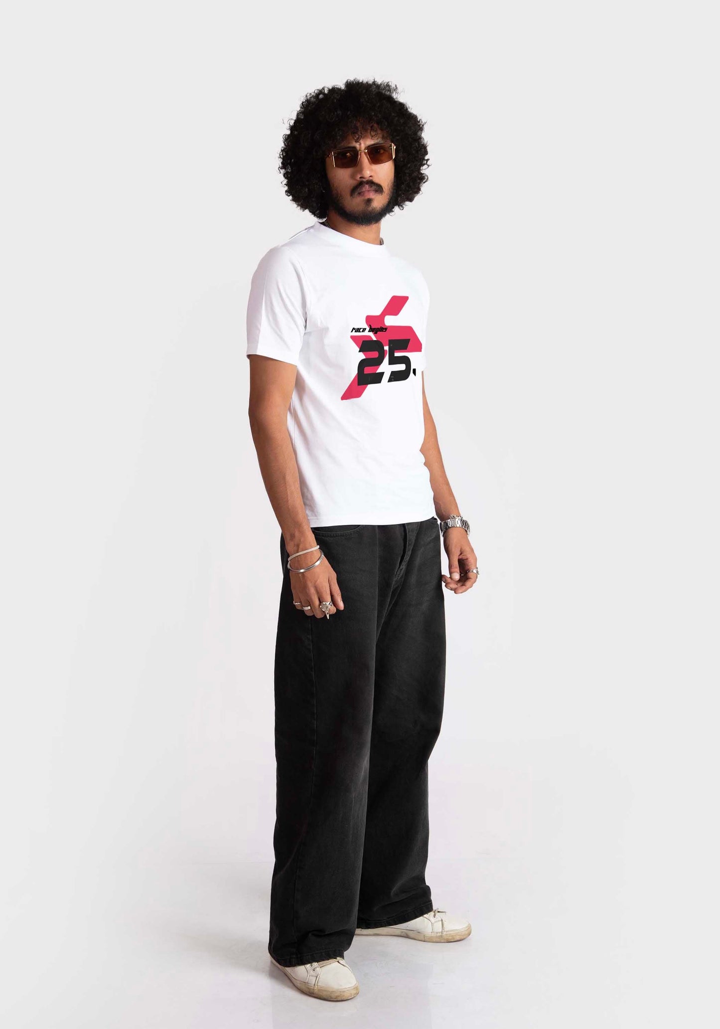 Stylera regular fit white tee with red and black graphic print worn by male model with black pants