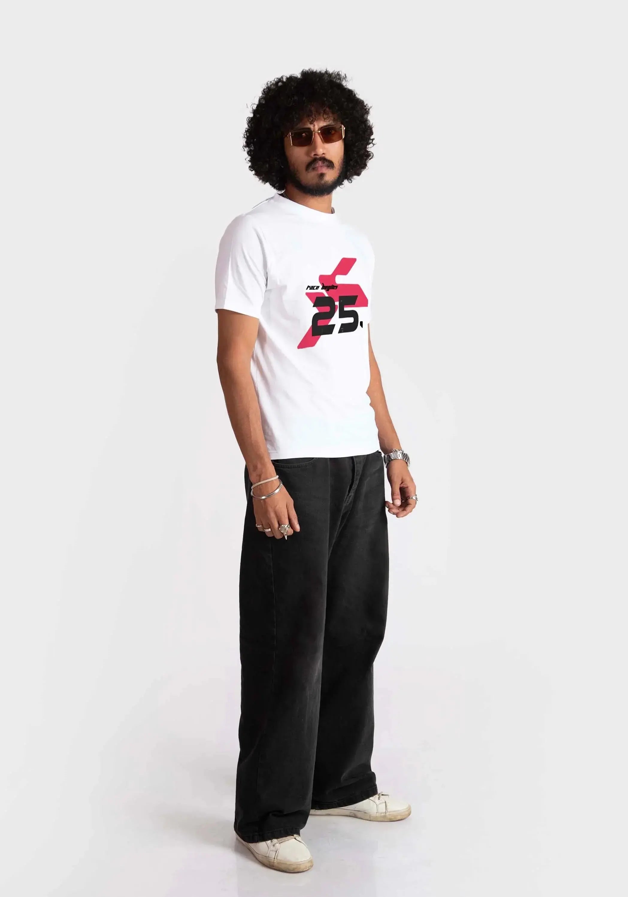 Stylera regular fit white tee with red and black graphic print worn by male model with black pants