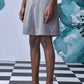 Stylera gray knee length pleated shorts on model, relaxed fit shorts for everyday wear.
