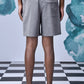 Stylera gray tailored shorts back view on model with black sandals relaxed fit shorts for everyday wear