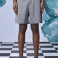 Stylera gray knee length shorts on model with black sandals relaxed fit shorts for everyday wear