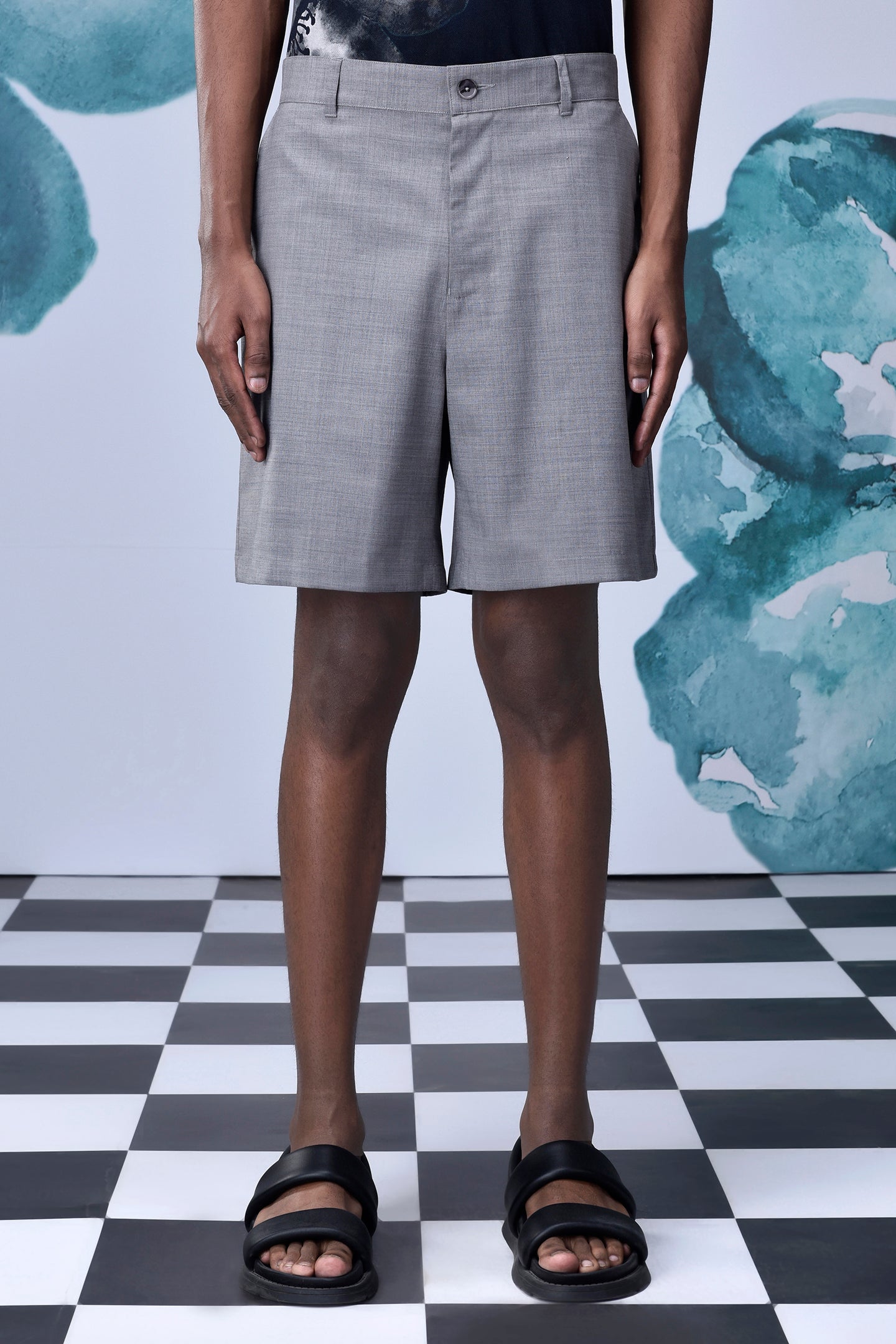 Stylera gray knee length shorts on model with black sandals relaxed fit shorts for everyday wear