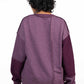 Stylera reversible oversized sweatshirt back view in two tone plum purple with dropped shoulders and relaxed fit