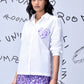 Stylera white sequin heart shirt women with purple floral skirt worn by model