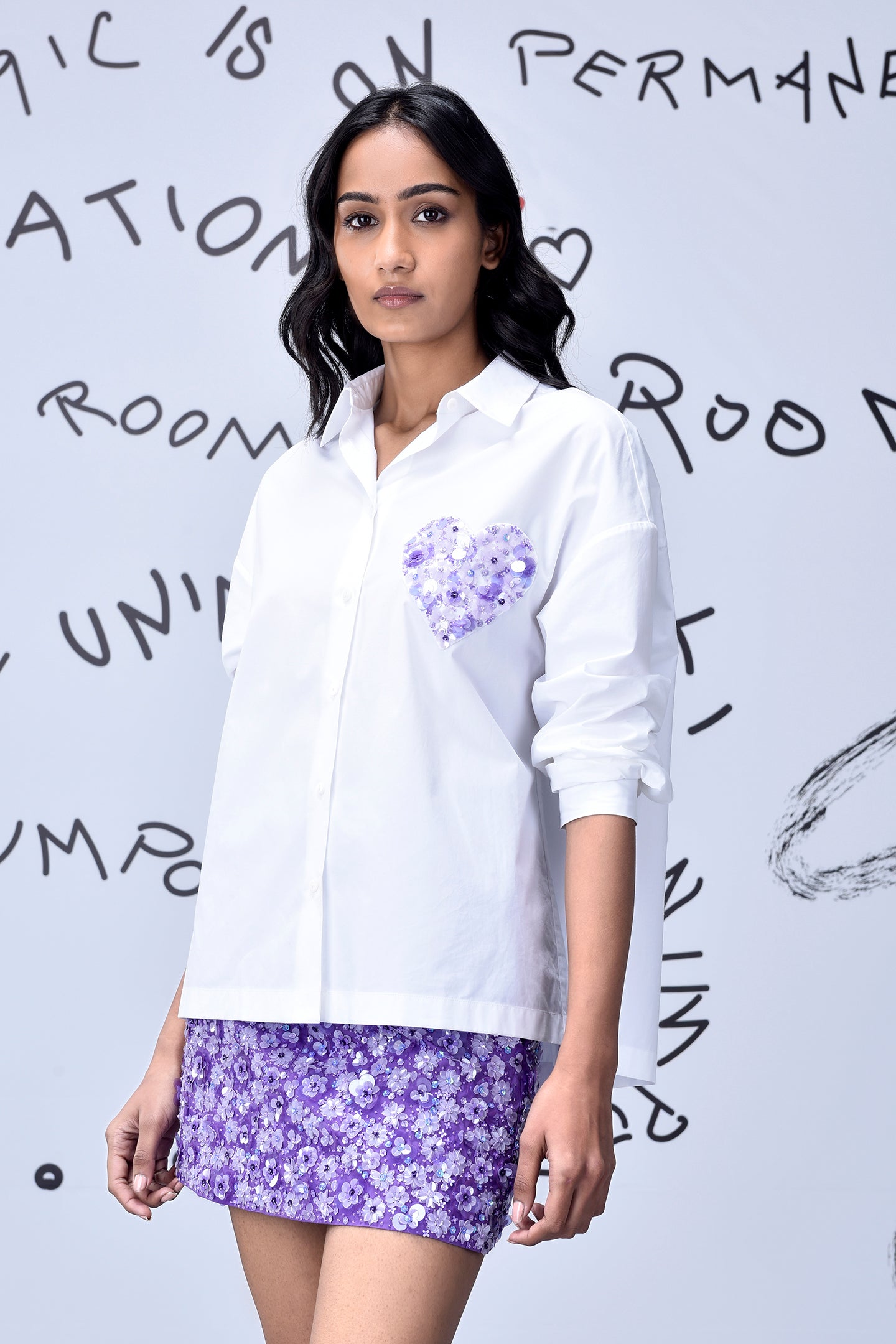 Stylera white sequin heart shirt women with purple floral skirt worn by model