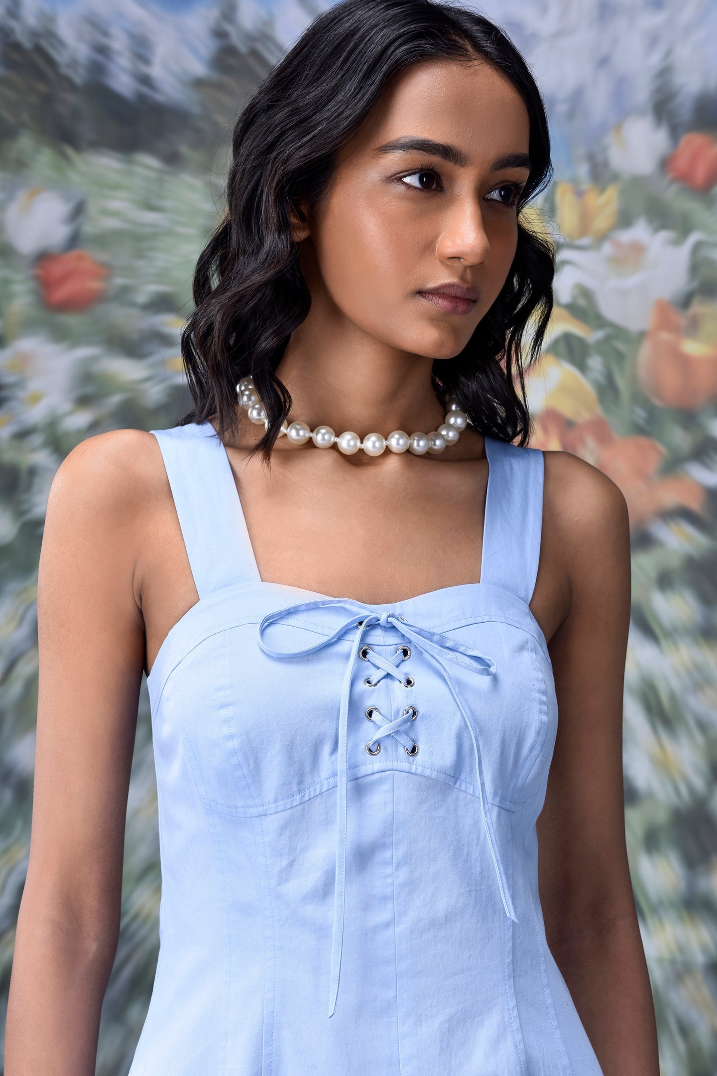 Slim fit casual dress with lace up front by Stylera in light blue sleeveless design